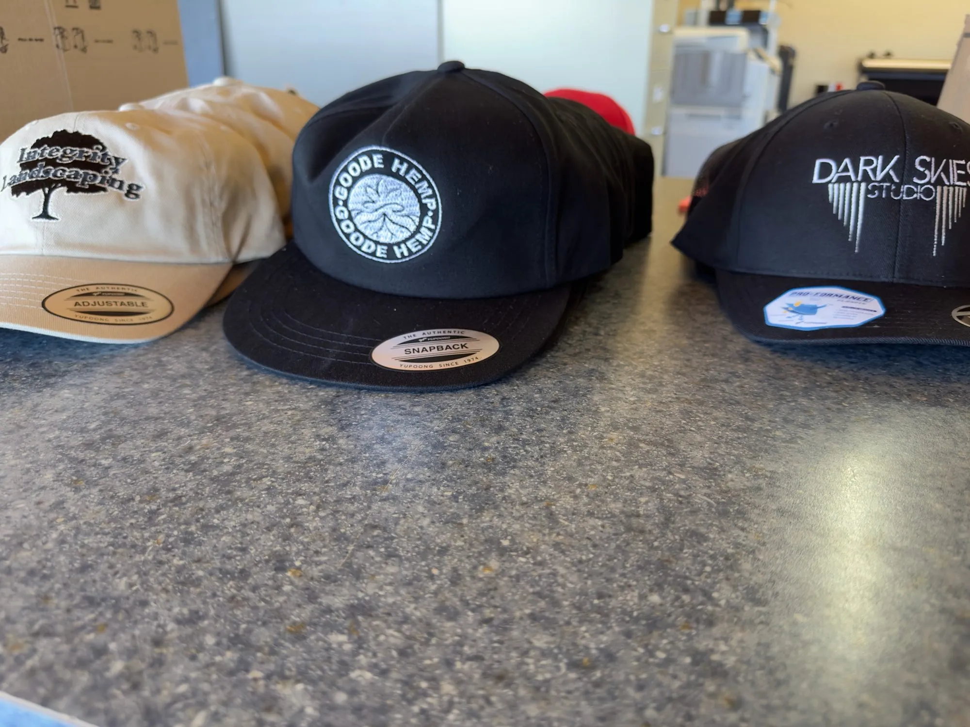 Branded caps displayed on a countertop