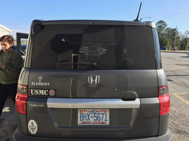 USMC and retirement lettering on the rear of a Honda vehicle