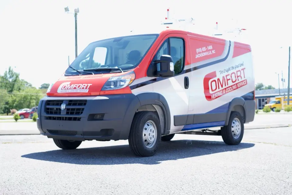Comfort Heating & Cooling Service van with red, white, and blue graphics