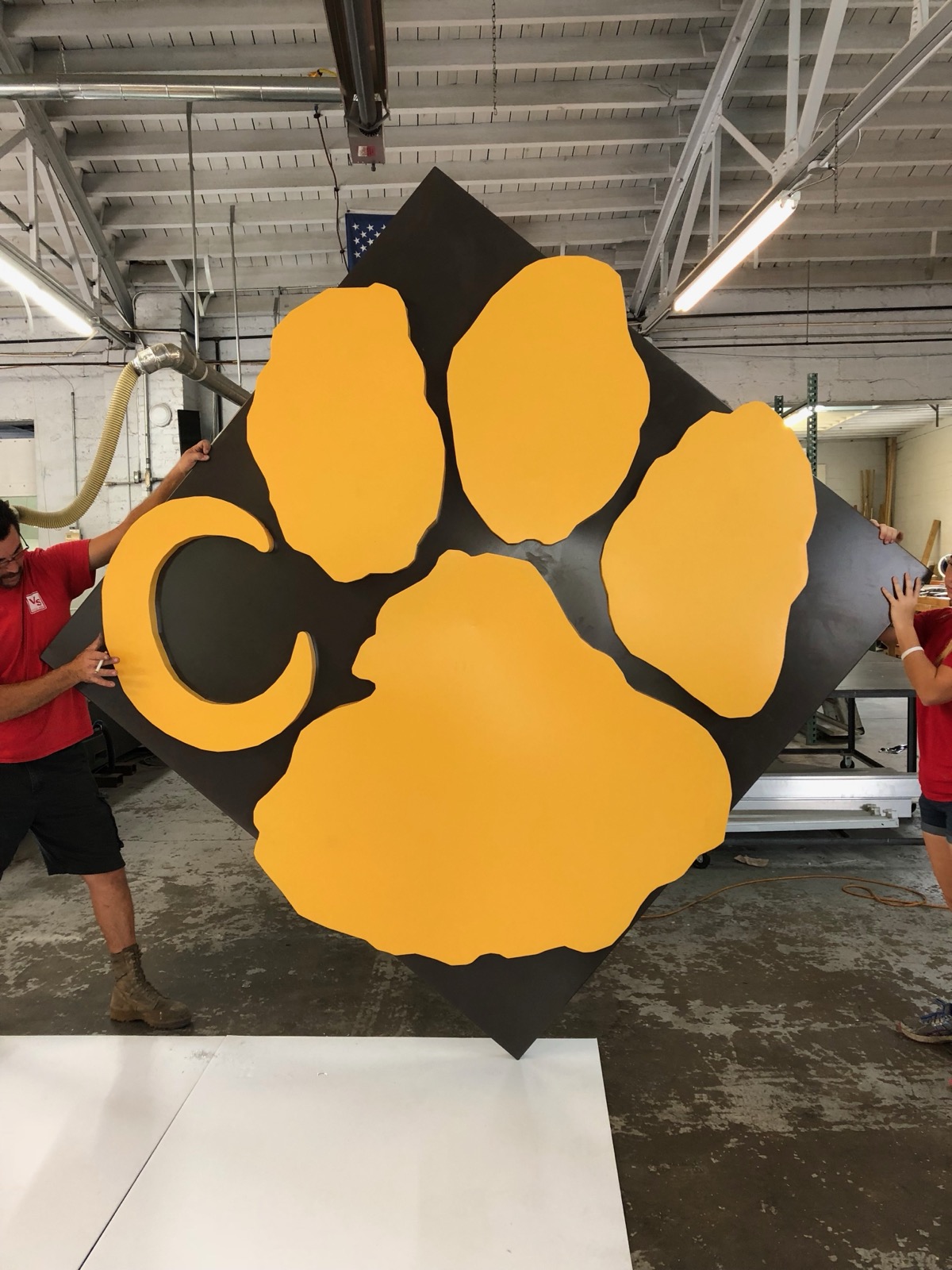 Team with fabricated sign