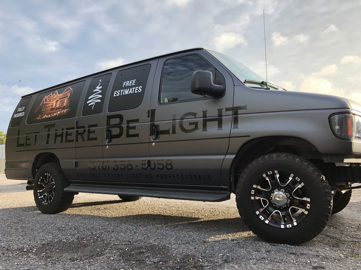 Matte black lighting company van wrap